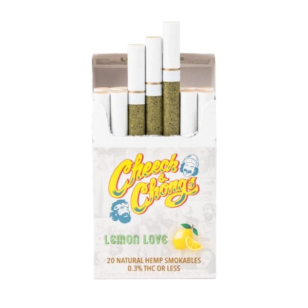 A pack of Cheech & Chong's Lemon Love natural hemp smokables with 20 cigarettes visible in the open box, containing 0.3% THC or less, and a Cheech & Chong Laser Engraved Grinder.