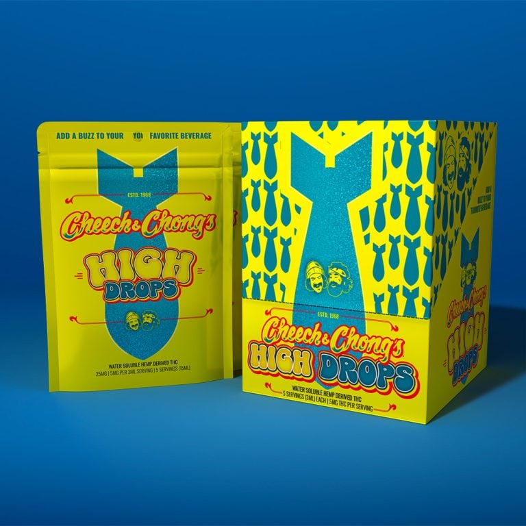 Two "cheech & chong's high drops" beverage enhancer packages on a blue background. the left package is upright and the right one is slightly leaning, both showcasing vibrant yellow and blue designs.