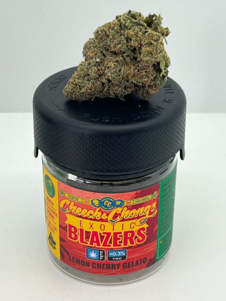 A large bud of marijuana, complete with lab results, is placed on top of a closed jar labeled "cheese chong's exotics blazers, lemon cherry gelato" with colorful, funky